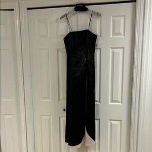 Beautiful debut two tone, black and pink evening gown with star accents